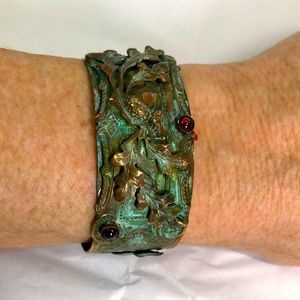 Inset garnets most likely brass cuff